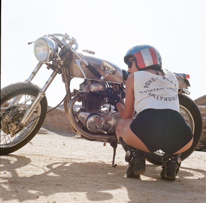 A playful frame from Girls on a motorcycle — online in Washington